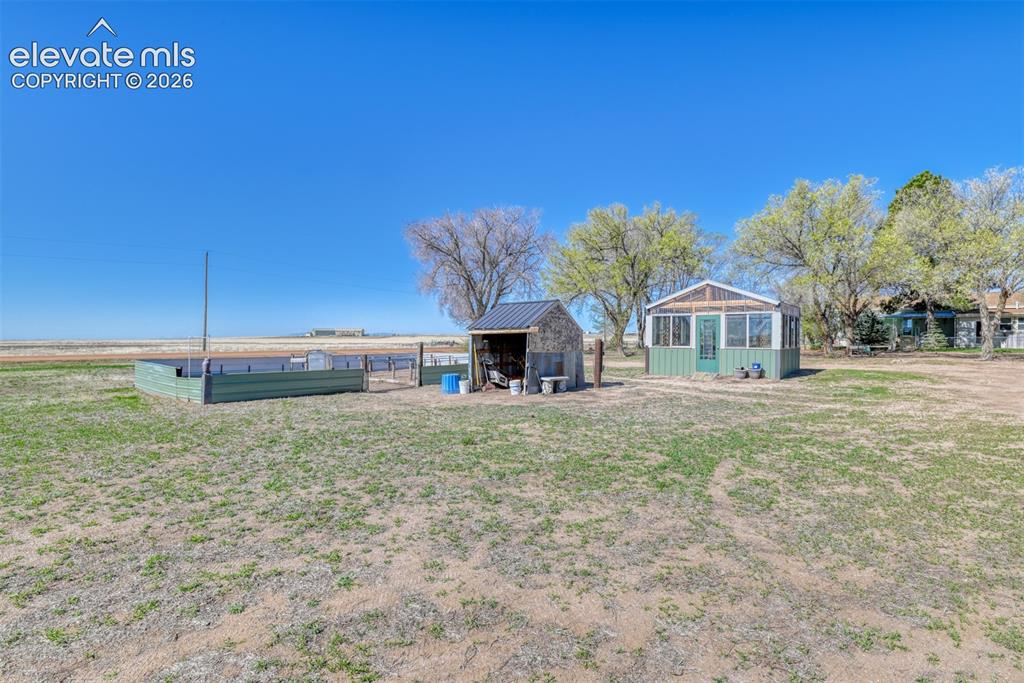 22558 Enoch Road Calhan, CO 80808 - Photo 47 of 50 a front view of a house with garden