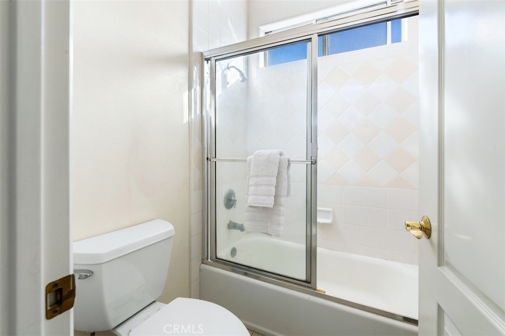 417 California Street, Unit F Arcadia, CA 91006 - Photo 11 of 21 a bathroom with a glass shower door