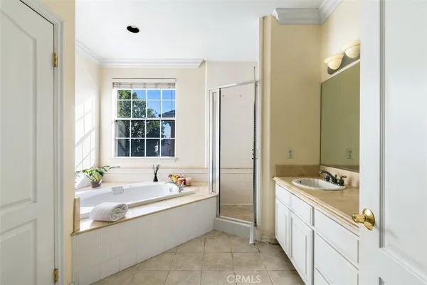 a bathroom with a sink vanity and a mirror
