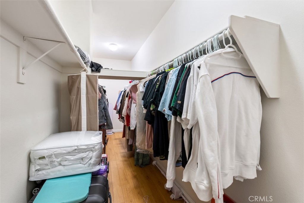 417 California Street, Unit F Arcadia, CA 91006 - Photo 17 of 21 a view of walk in closet with clothes and shoes