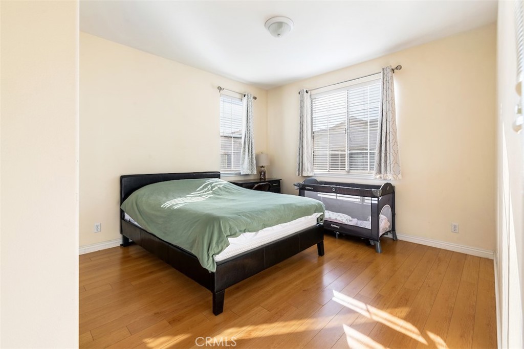 417 California Street, Unit F Arcadia, CA 91006 - Photo 19 of 21 a bedroom with a bed and wooden floor