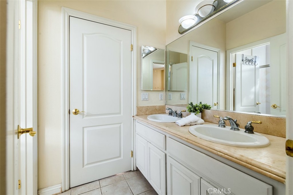 417 California Street, Unit F Arcadia, CA 91006 - Photo 20 of 21 a bathroom with a sink and a mirror