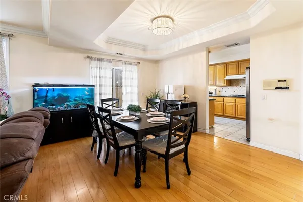 a view of a dining room with furniture and wooden floor