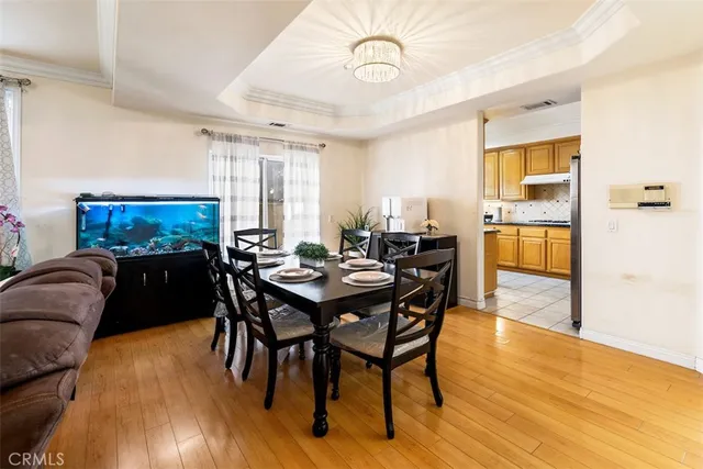 a view of a dining room with furniture and wooden floor