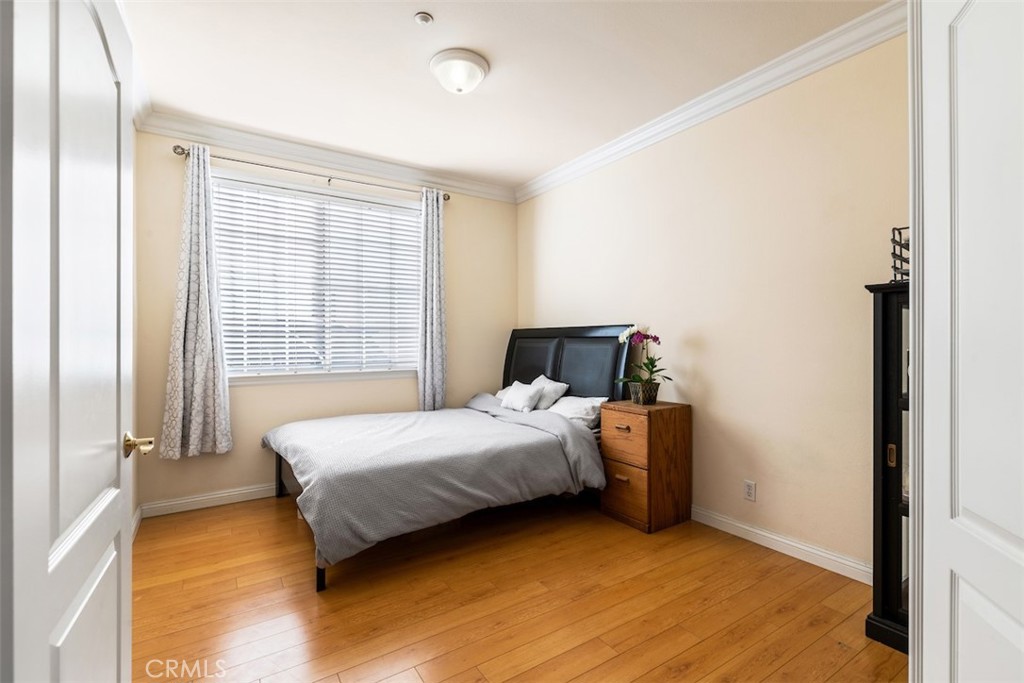 417 California Street, Unit F Arcadia, CA 91006 - Photo 10 of 21 a bedroom with a bed and wooden floor