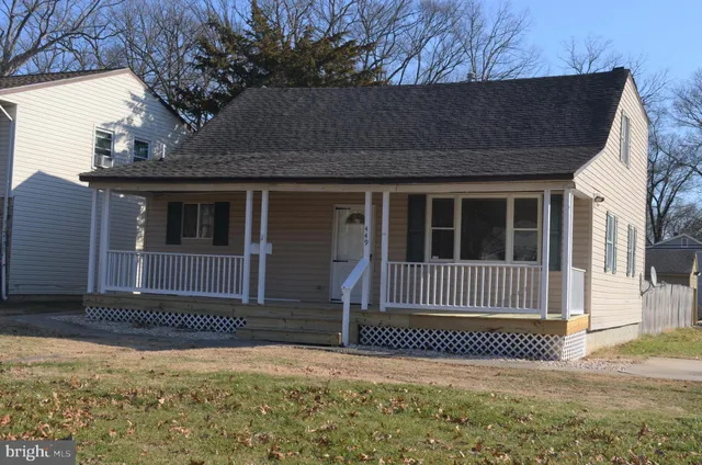 a front view of a house with a fence
