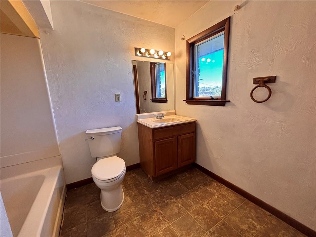 2695 West Chestnut Street, Unit 2 Washington, PA 15301 - Photo 9 of 12 a bathroom with a sink toilet mirror and vanity