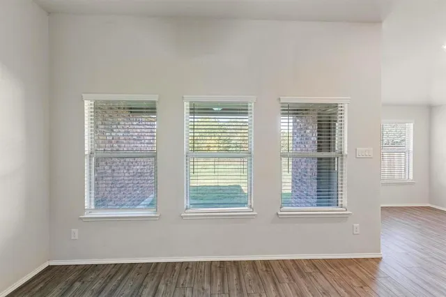 a view of a bathroom with wooden floor