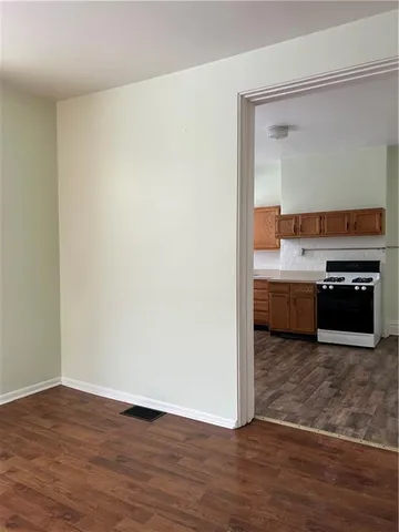 a view of a kitchen with a sink and a stove top oven