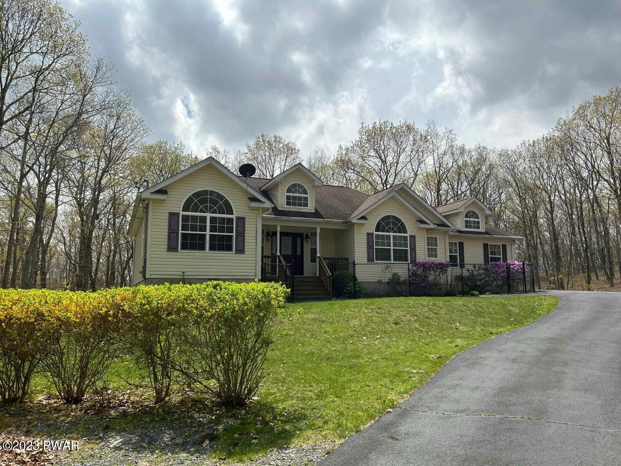 131 Maple Ridge Road Milford, PA 18337 - Photo 35 of 54 a front view of a house with a yard