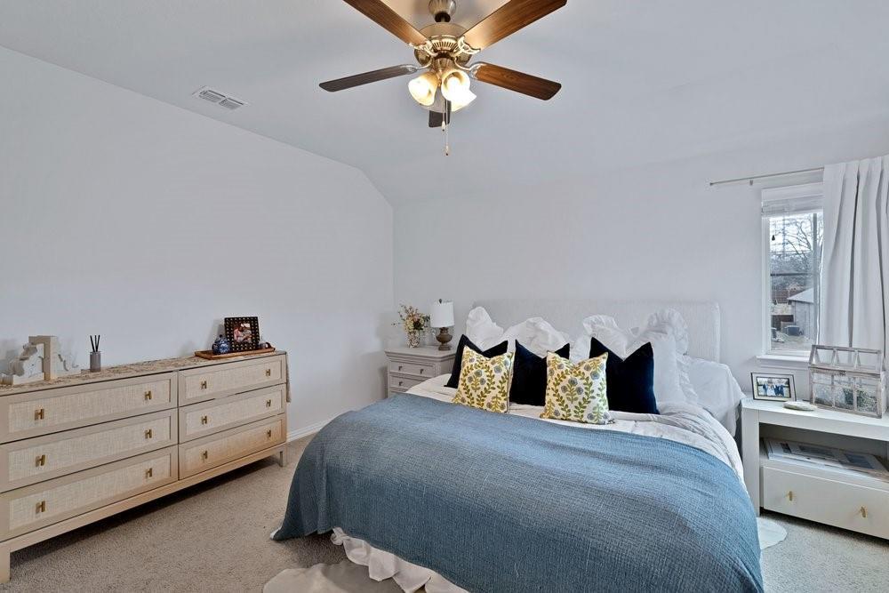 4105 Ranchman Boulevard Denton, TX 76210 - Photo 31 of 39 a bedroom with a bed and a dresser