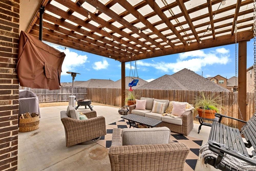 4105 Ranchman Boulevard Denton, TX 76210 - Photo 32 of 39 a outdoor living space with patio furniture and a potted plant