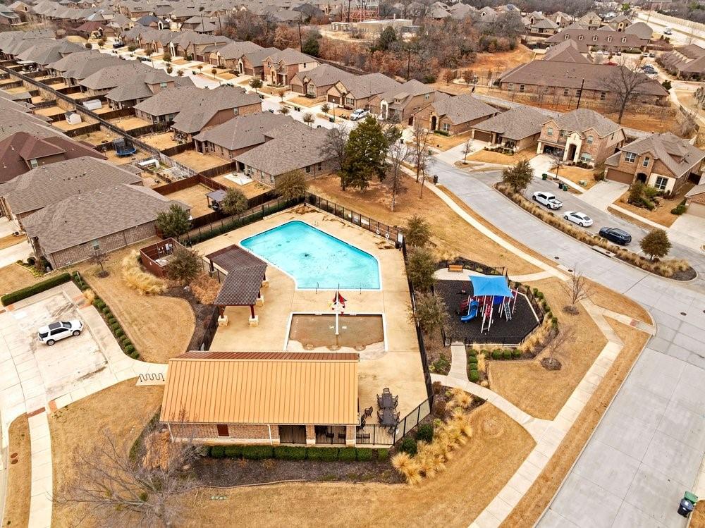 4105 Ranchman Boulevard Denton, TX 76210 - Photo 36 of 39 an aerial view of a house with a swimming pool