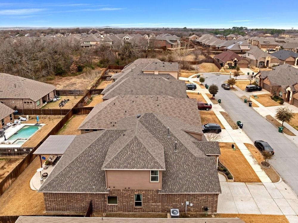 4105 Ranchman Boulevard Denton, TX 76210 - Photo 38 of 39 an aerial view of residential houses with outdoor space