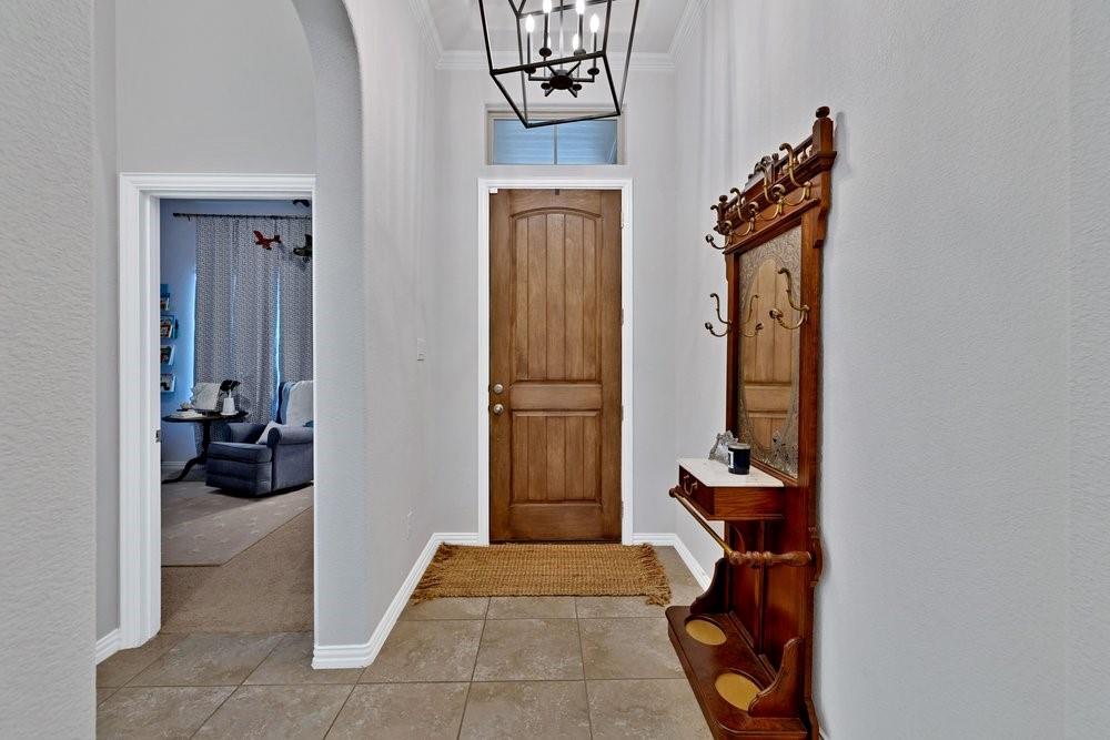 4105 Ranchman Boulevard Denton, TX 76210 - Photo 4 of 39 a view of a hallway with couch and closet