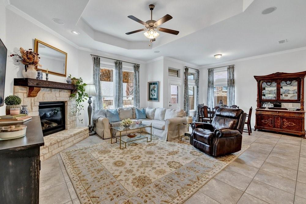 4105 Ranchman Boulevard Denton, TX 76210 - Photo 6 of 39 a living room with furniture and a fireplace