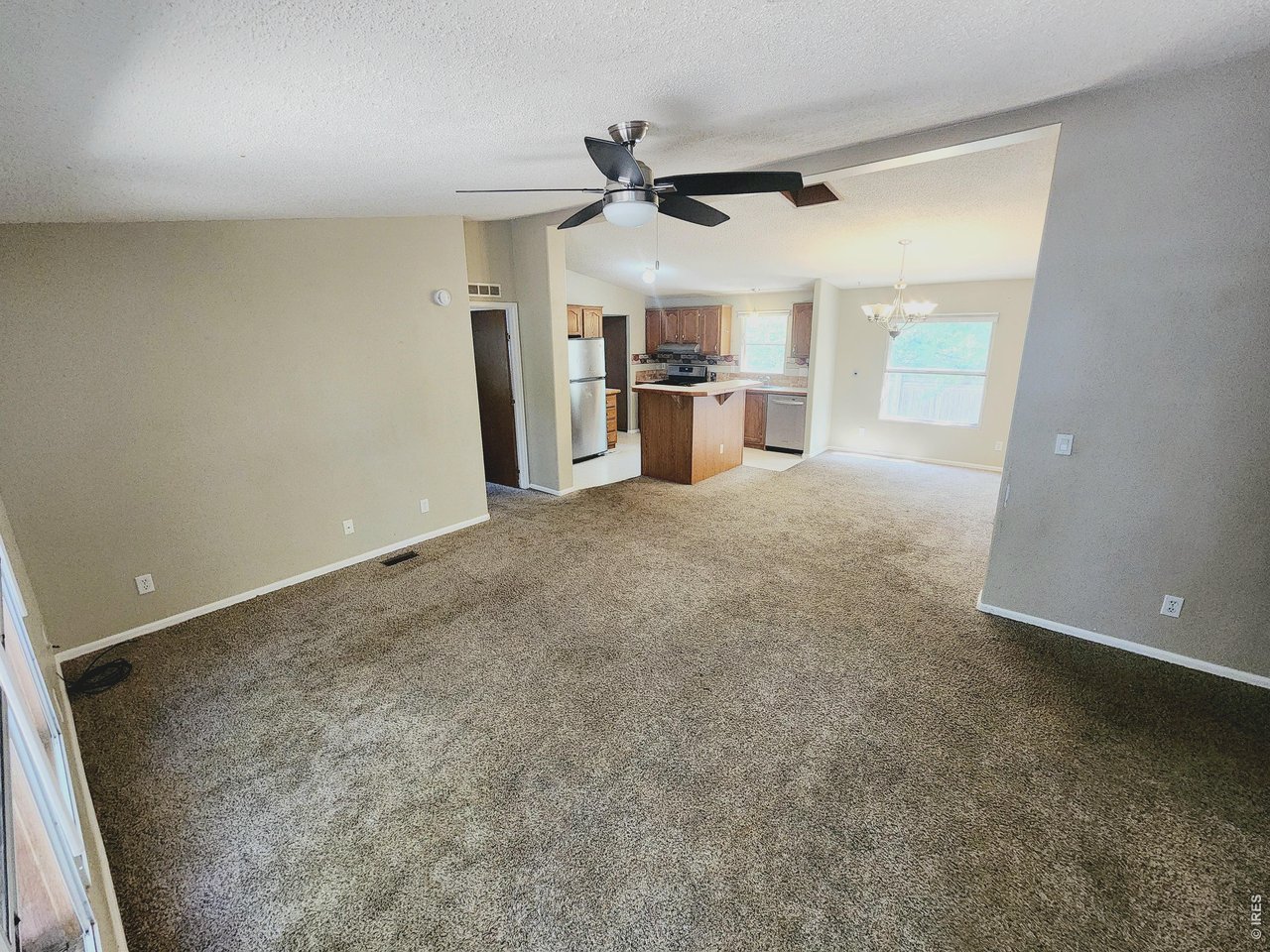 425 Platte Street Sterling, CO 80751 - Photo 14 of 22 back house living and kitchen