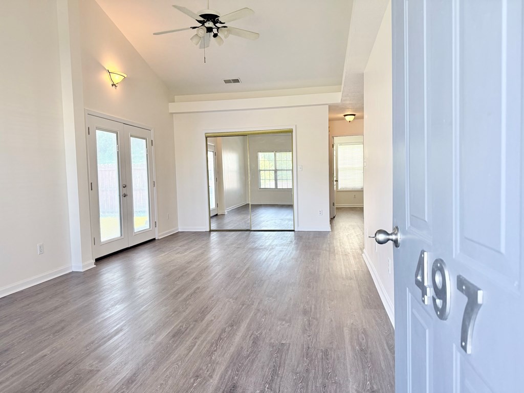 497 Sivley Road Hopkinsville, KY 42240 - Photo 3 of 20 wooden floor in an empty room with a window