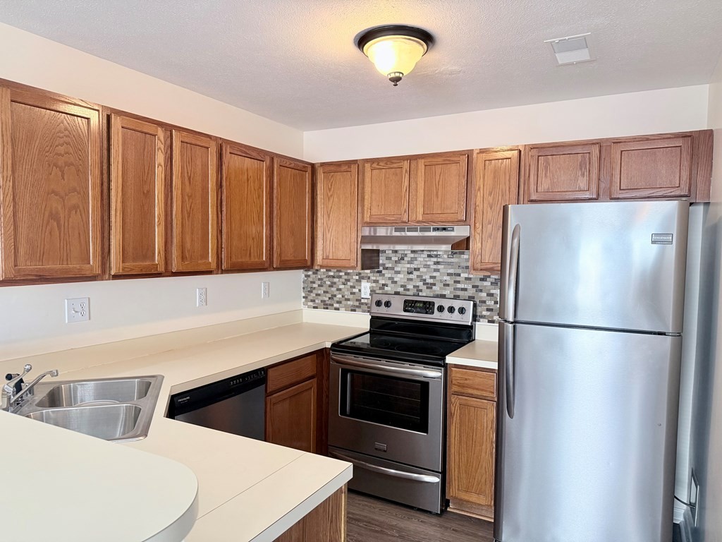 497 Sivley Road Hopkinsville, KY 42240 - Photo 6 of 20 a kitchen with a white stove top oven and refrigerator