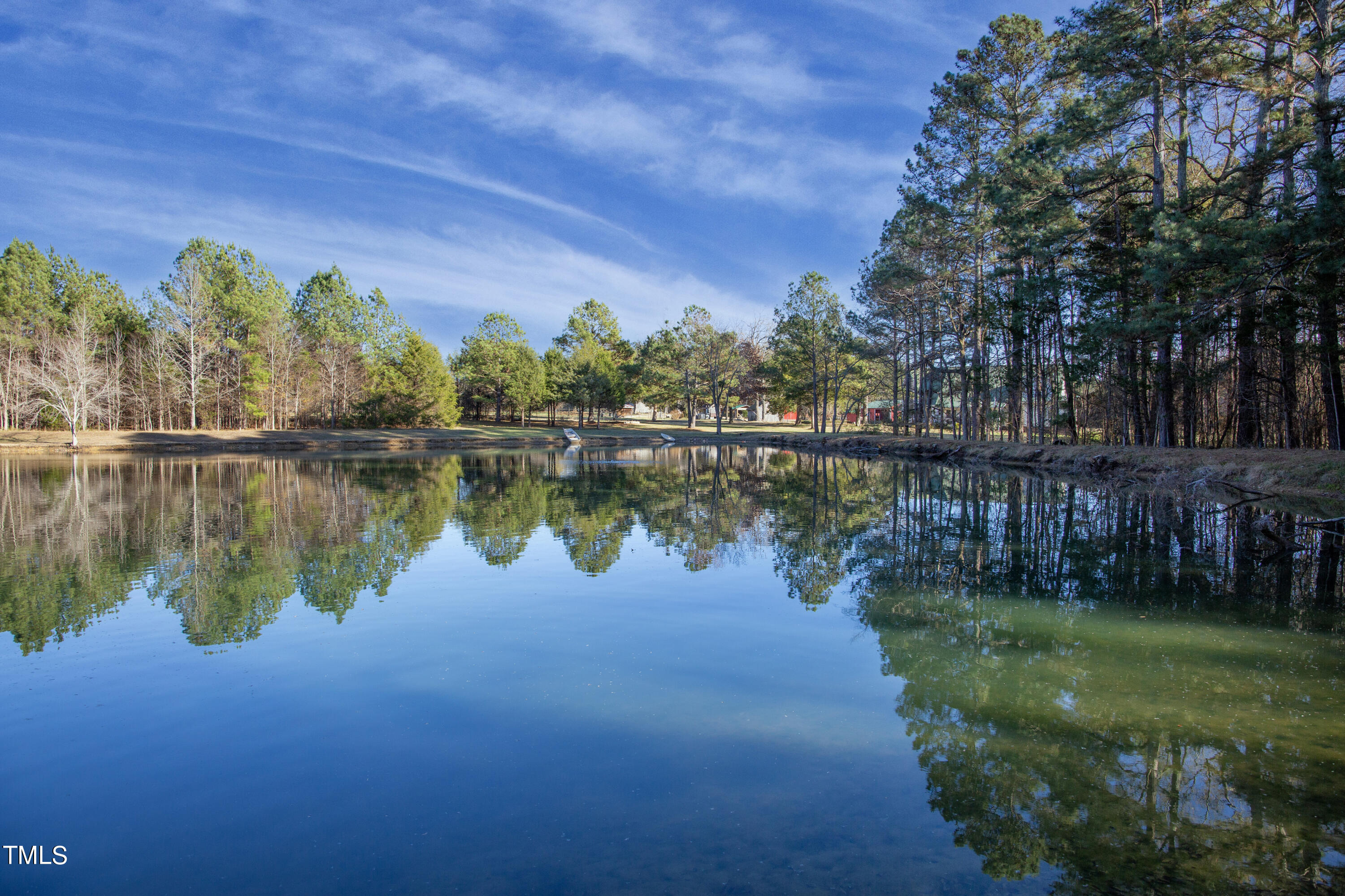 531 Archie Johnson Road Siler City, NC 27344 - Photo 17 of 46 a view of a lake with houses in the back
