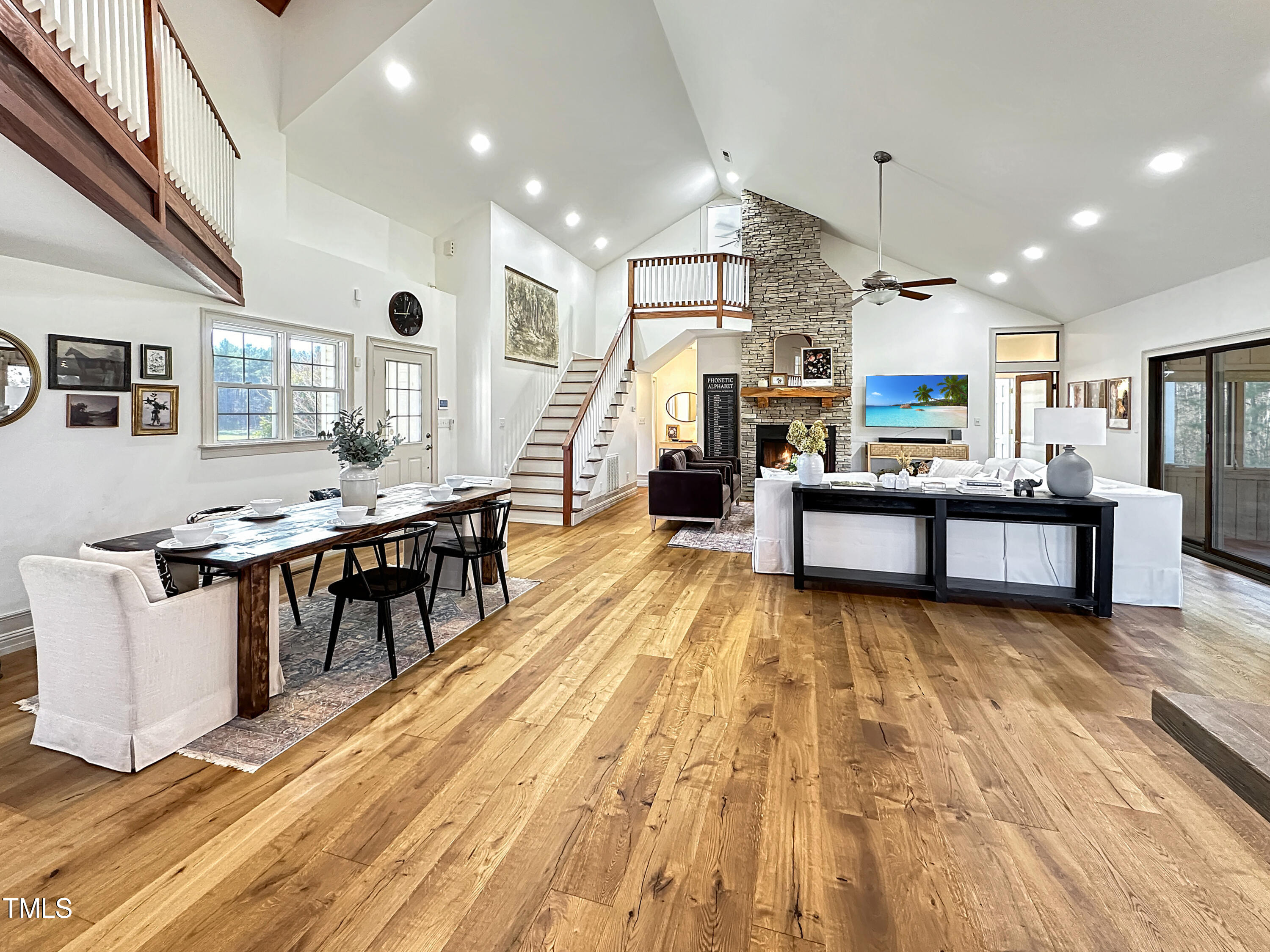 531 Archie Johnson Road Siler City, NC 27344 - Photo 24 of 46 a living room with stainless steel appliances kitchen island granite countertop furniture wooden floor and a kitchen view