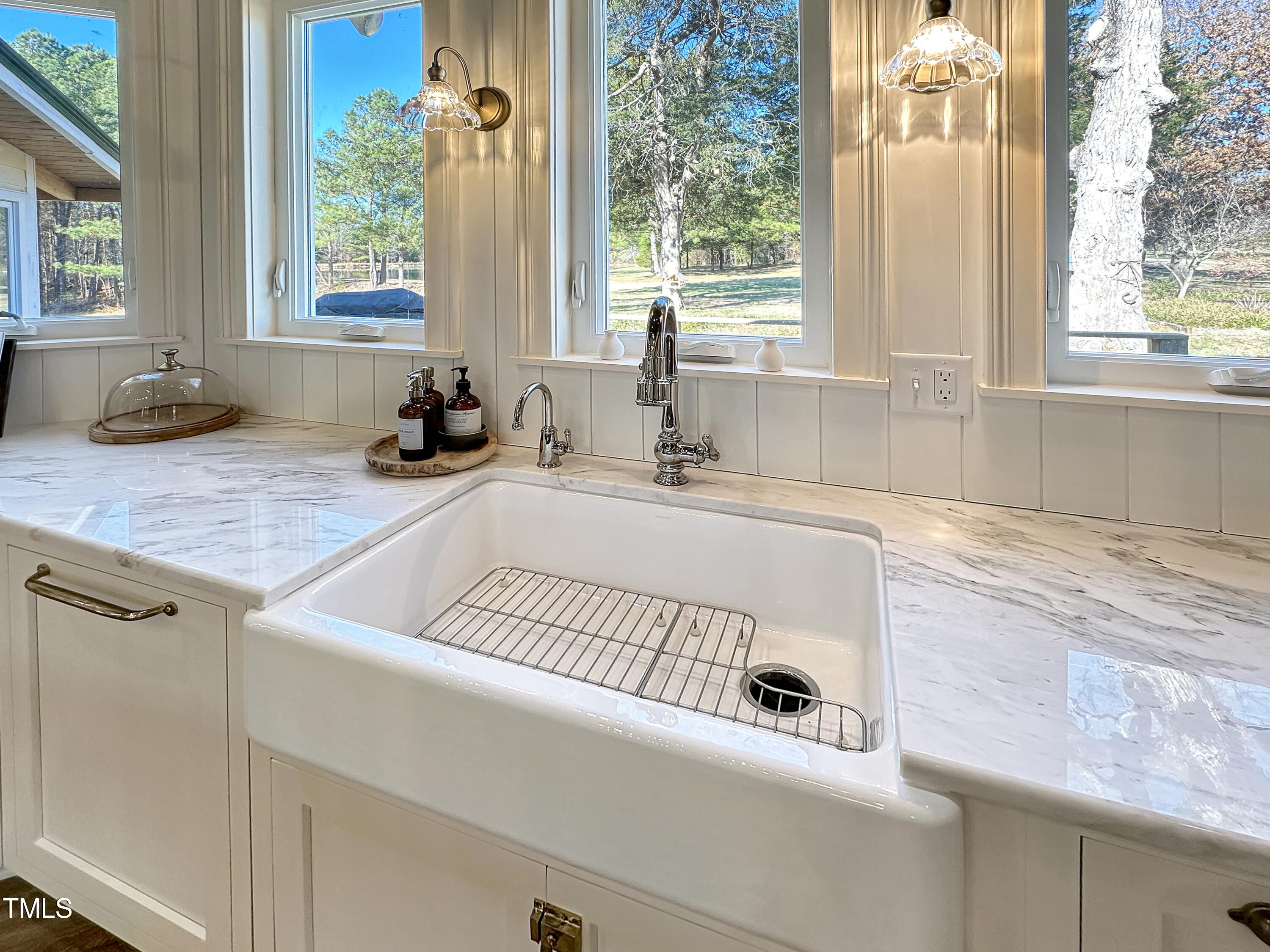 531 Archie Johnson Road Siler City, NC 27344 - Photo 29 of 46 a kitchen with a sink a counter and a window