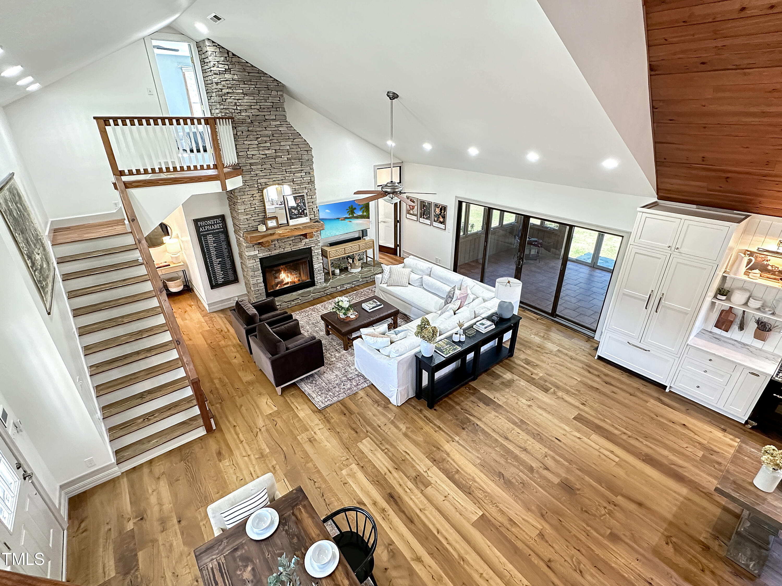 531 Archie Johnson Road Siler City, NC 27344 - Photo 32 of 46 a living room with furniture and a wooden floor