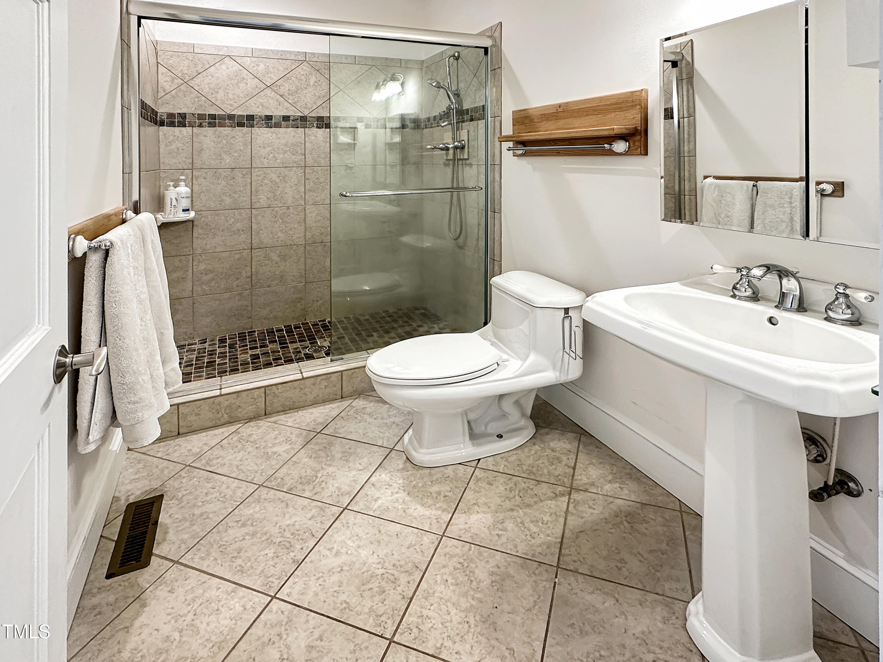 531 Archie Johnson Road Siler City, NC 27344 - Photo 35 of 46 a bathroom with a sink toilet and shower