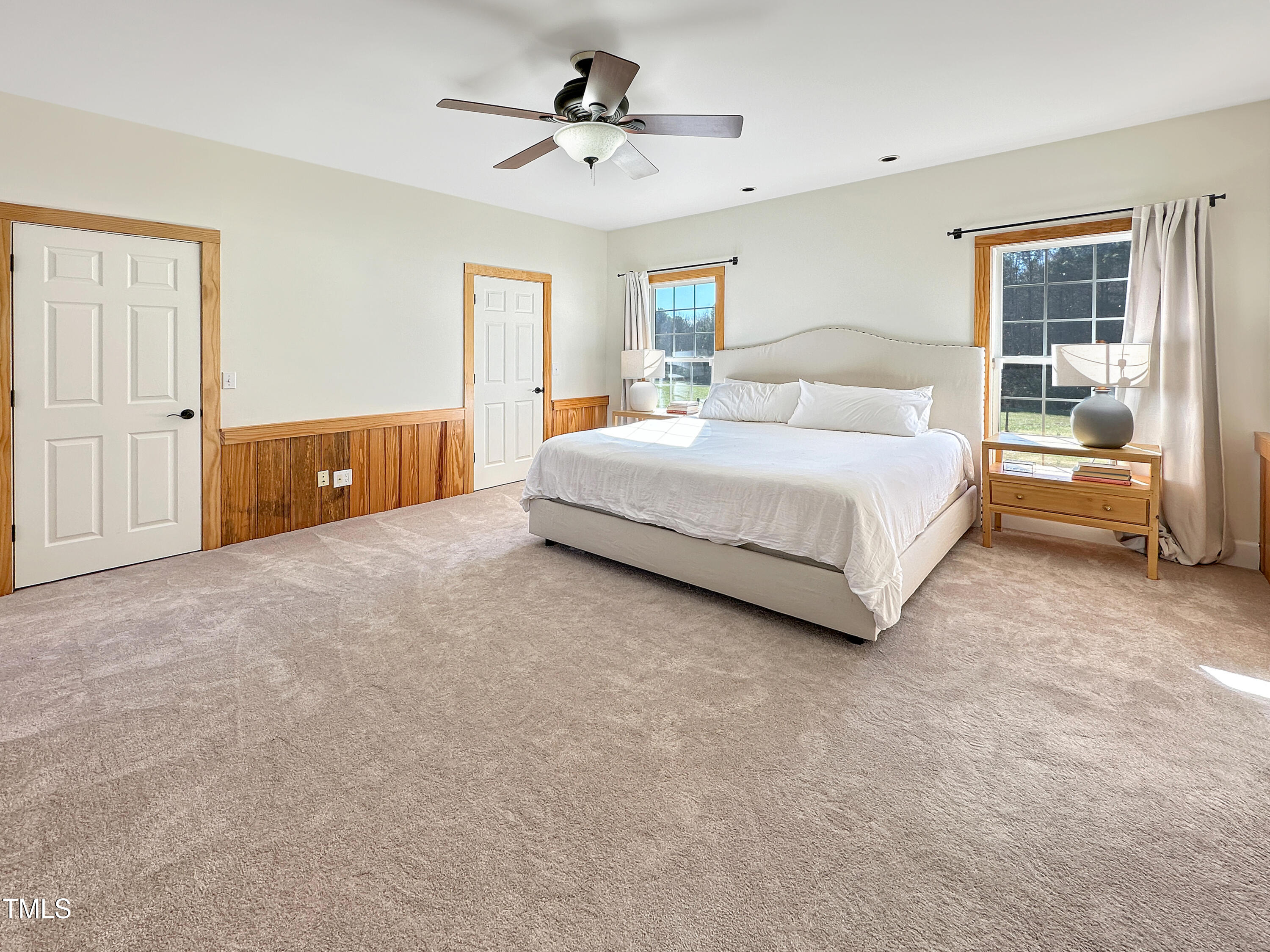 531 Archie Johnson Road Siler City, NC 27344 - Photo 38 of 46 a spacious bedroom with a bed and wooden floor