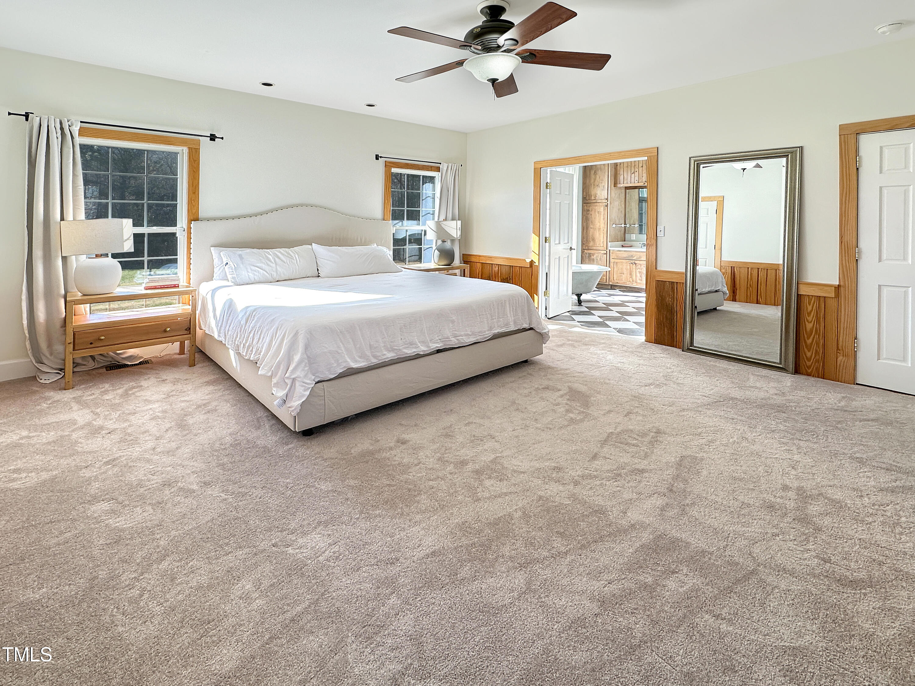 531 Archie Johnson Road Siler City, NC 27344 - Photo 39 of 46 a spacious bedroom with a large bed and a chandelier