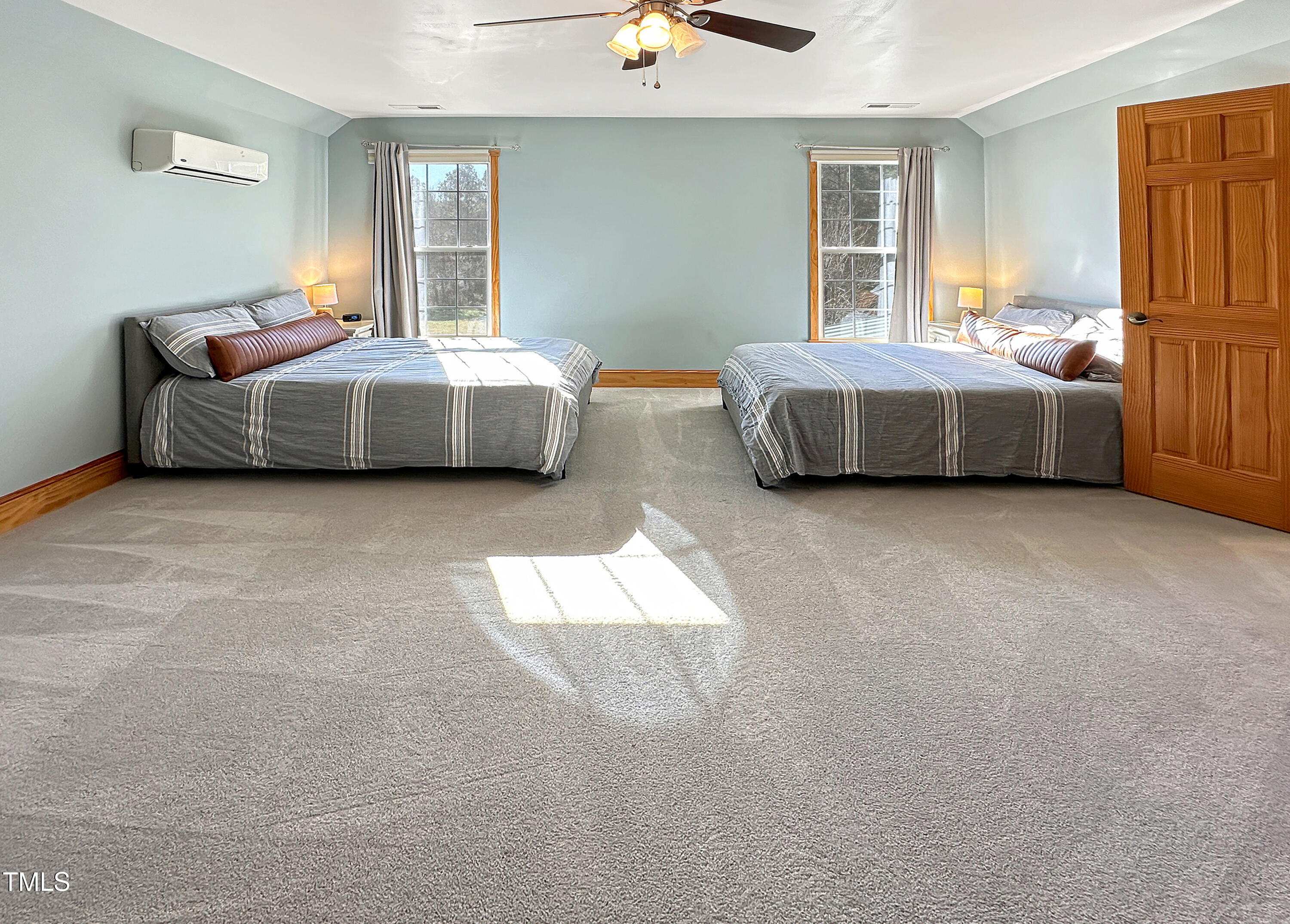 531 Archie Johnson Road Siler City, NC 27344 - Photo 42 of 46 a spacious bedroom with two beds and a window