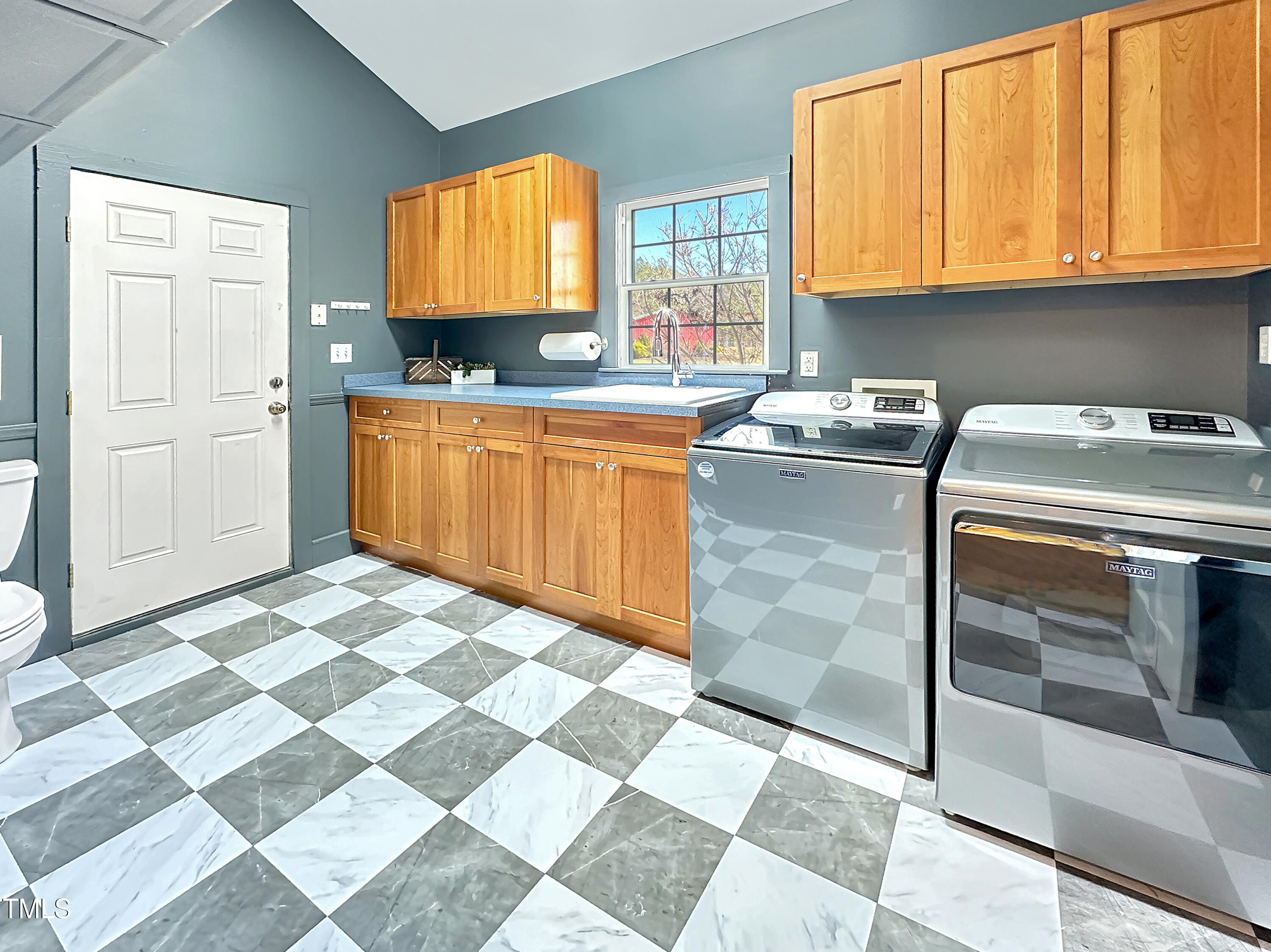 531 Archie Johnson Road Siler City, NC 27344 - Photo 44 of 46 a kitchen with stainless steel appliances granite countertop a stove a sink and a microwave