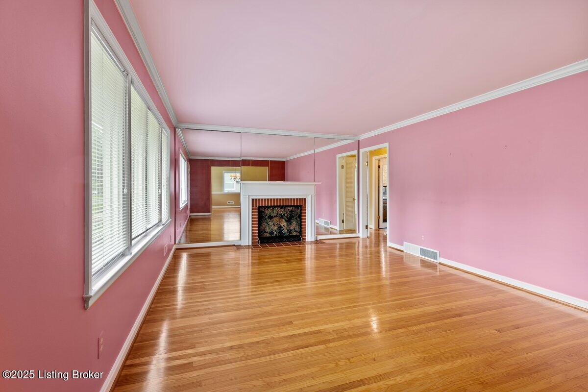 3531 Graham Road Louisville, KY 40207 - Photo 2 of 30 Huge living room with fireplace and crown molding