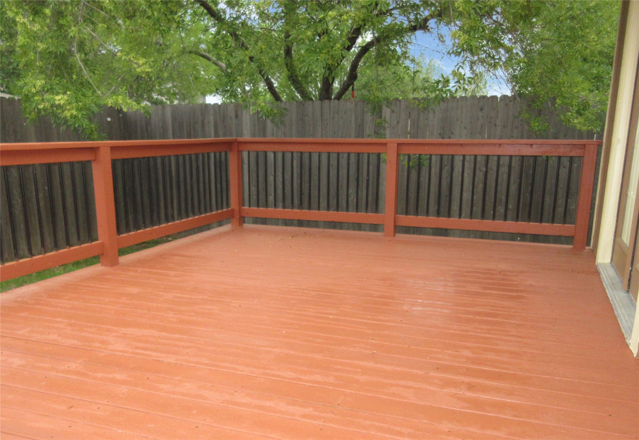 115 Rei Tang Loop Kyle, TX 78640 - Photo 16 of 17 a view of backyard with wooden floor and fence