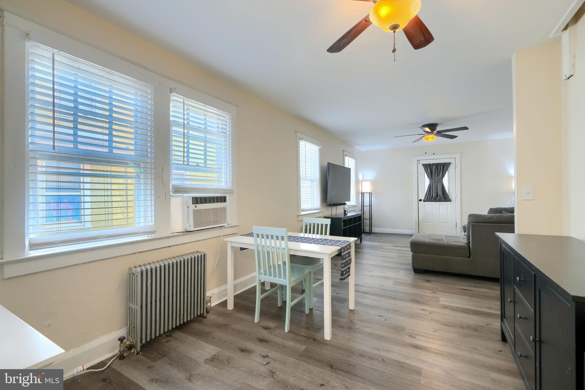 2818 Garnet Road Baltimore, MD 21234 - Photo 11 of 39 a view of a dining room with furniture window and wooden floor