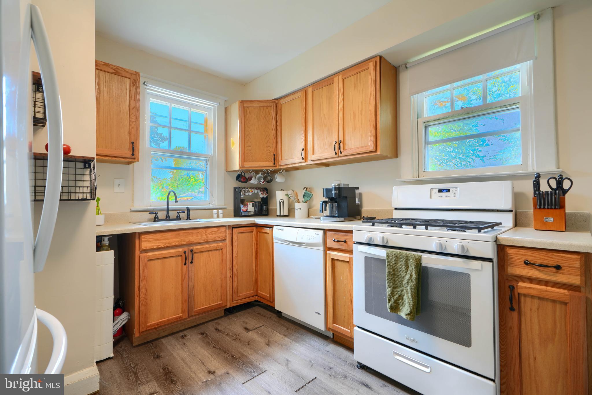 2818 Garnet Road Baltimore, MD 21234 - Photo 13 of 39 a kitchen with stainless steel appliances granite countertop a stove a sink and a microwave