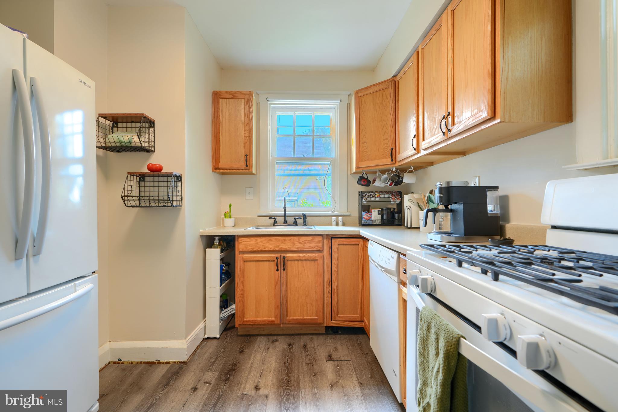 2818 Garnet Road Baltimore, MD 21234 - Photo 14 of 39 a kitchen with stainless steel appliances granite countertop a refrigerator stove and sink