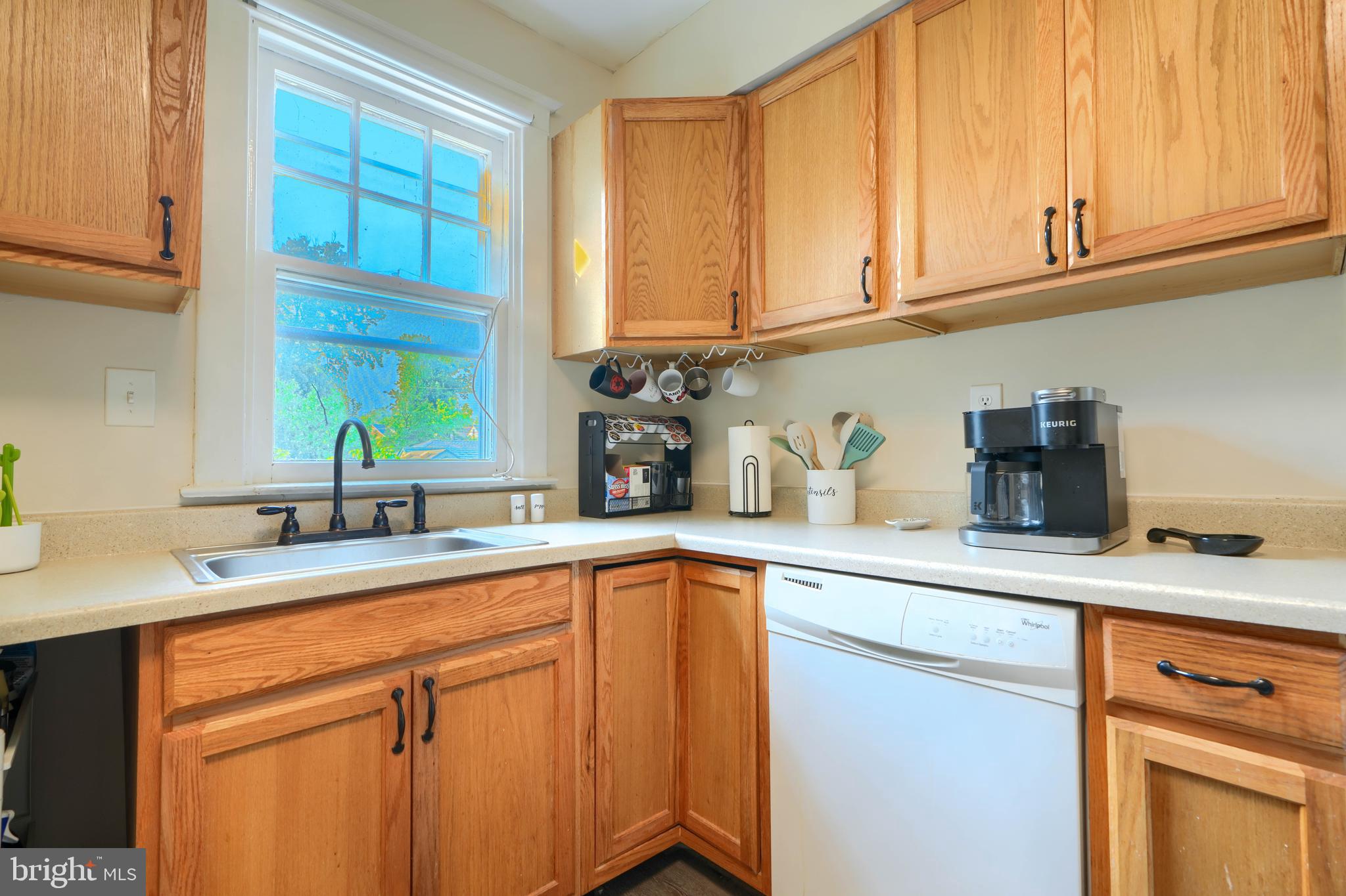 2818 Garnet Road Baltimore, MD 21234 - Photo 15 of 39 a kitchen with stainless steel appliances granite countertop a sink a stove and cabinets