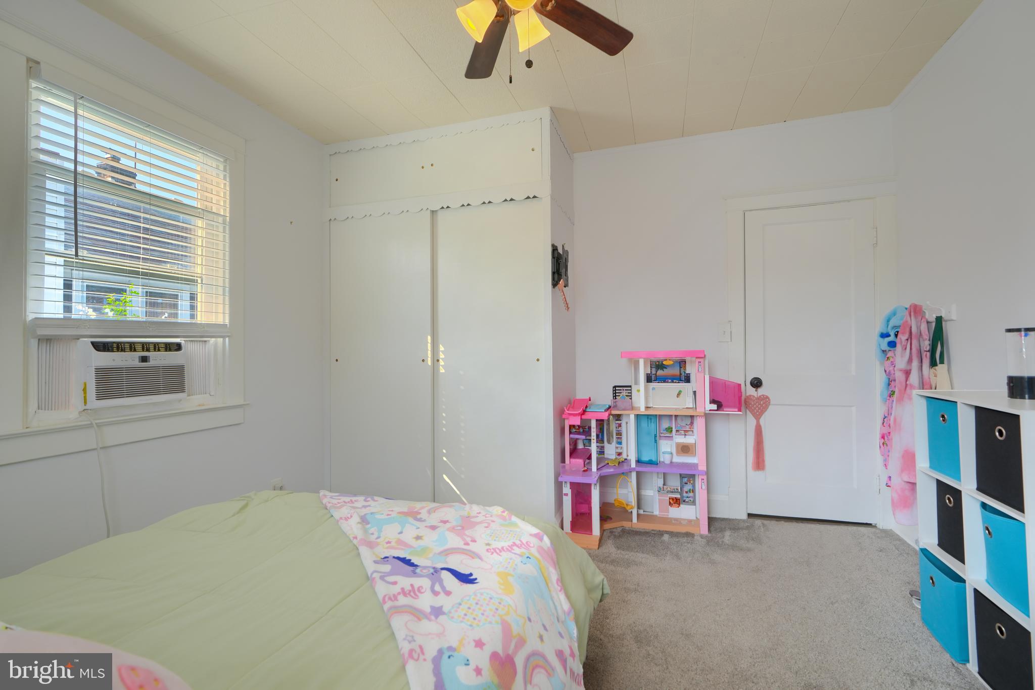 2818 Garnet Road Baltimore, MD 21234 - Photo 18 of 39 a bedroom with a bed and a chandelier