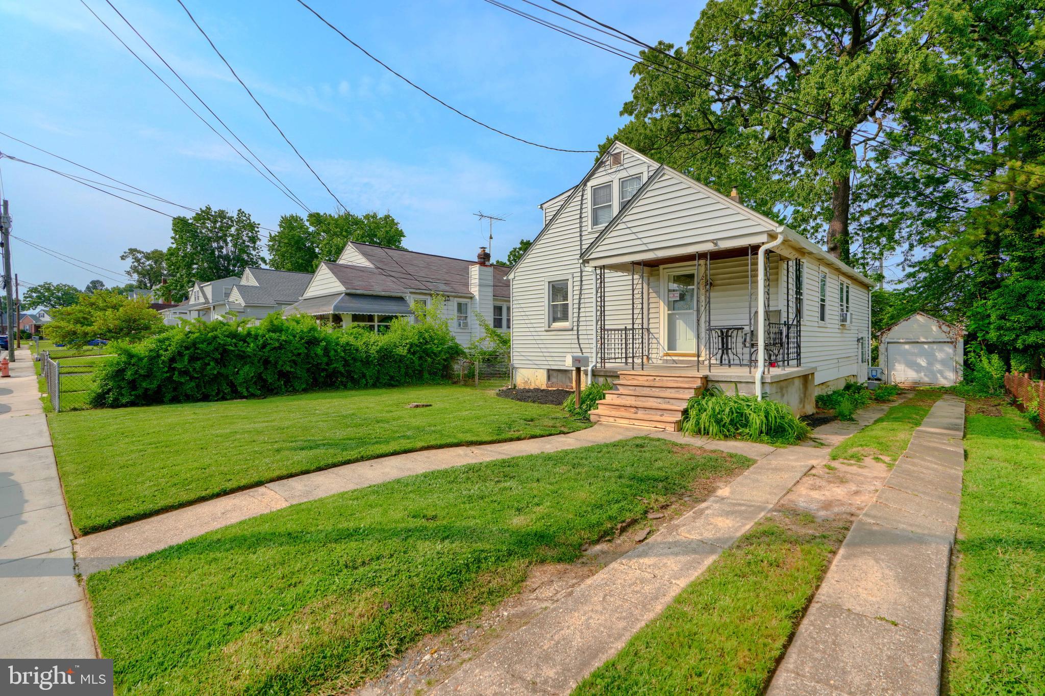 2818 Garnet Road Baltimore, MD 21234 - Photo 2 of 39 a front view of a house with a yard