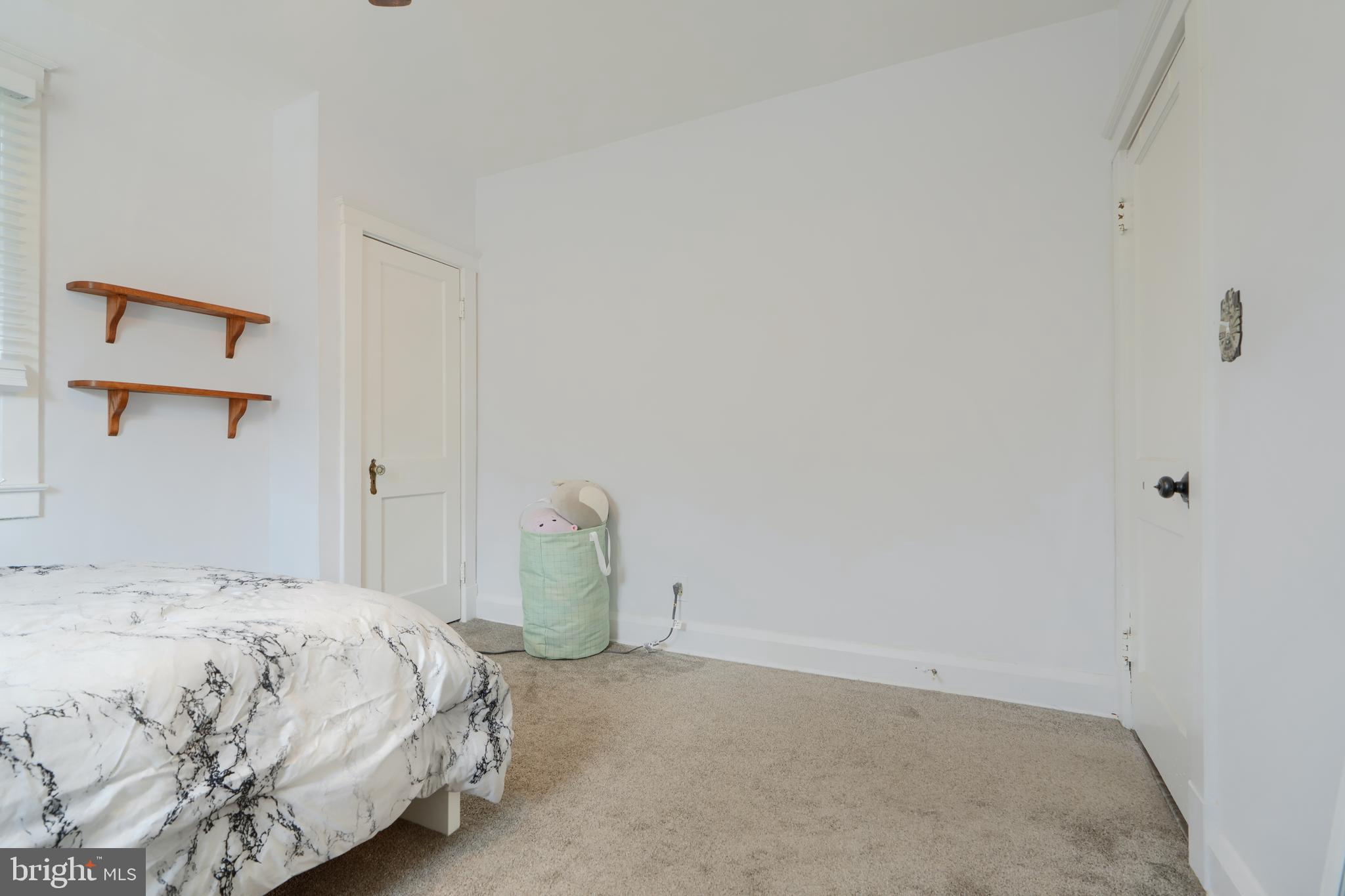 2818 Garnet Road Baltimore, MD 21234 - Photo 26 of 39 a bedroom with a bed and cabinets