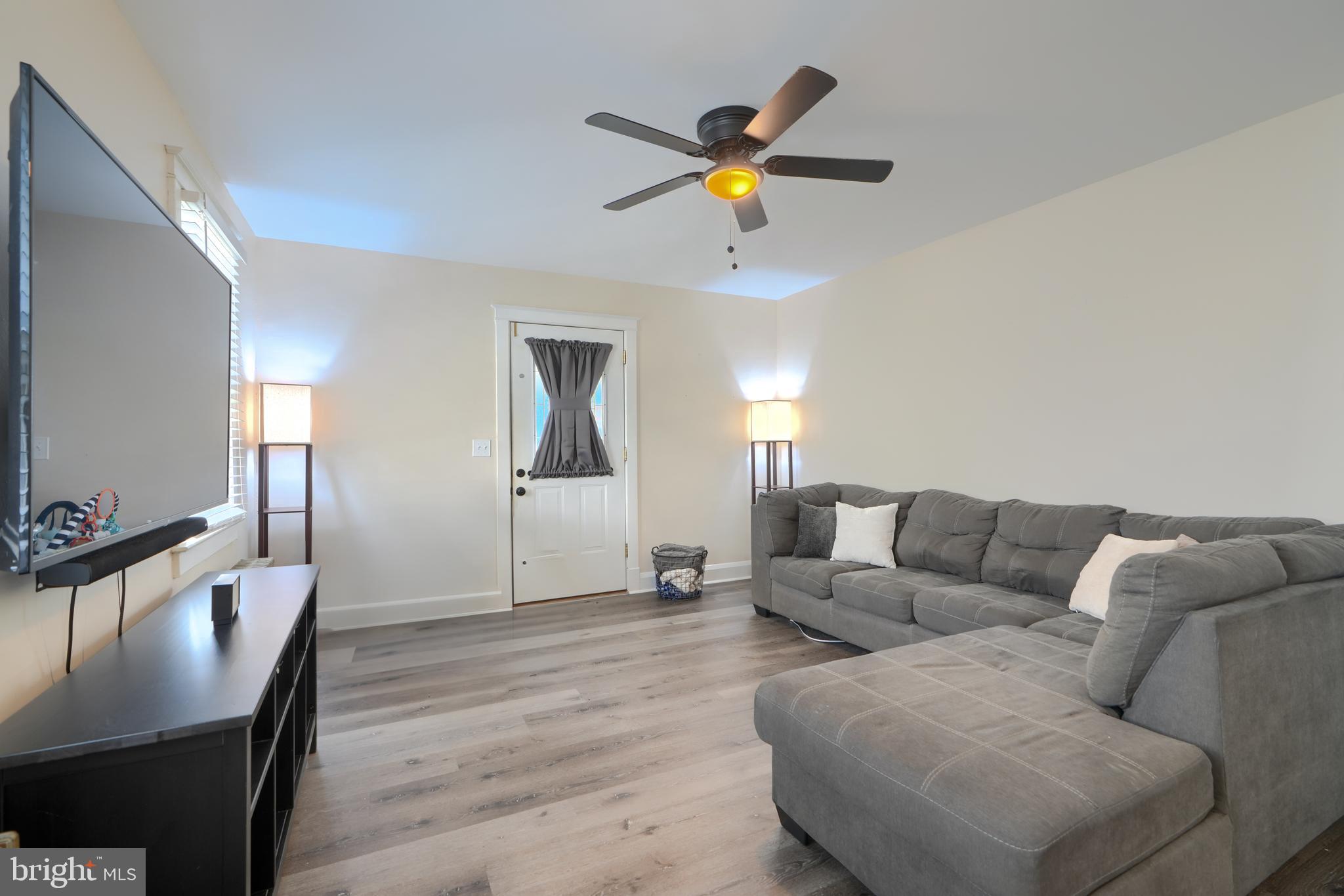 2818 Garnet Road Baltimore, MD 21234 - Photo 8 of 39 a living room with furniture and a wooden floor