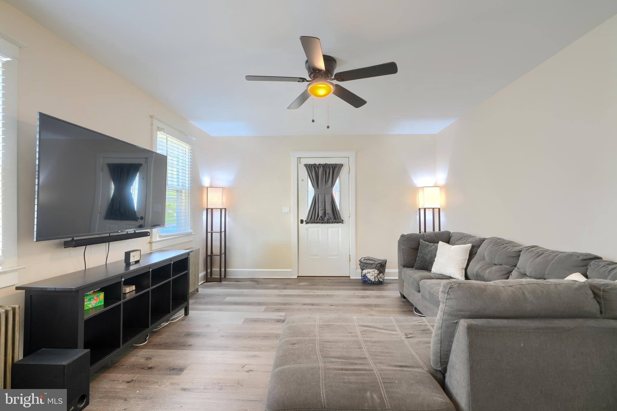 2818 Garnet Road Baltimore, MD 21234 - Photo 9 of 39 a living room with furniture and a flat screen tv