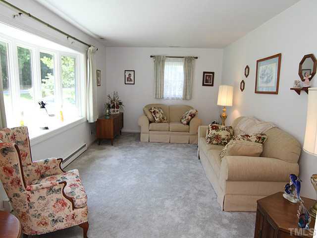 5649 Guess Road Durham, NC 27712 - Photo 2 of 12 a living room with furniture and a large window