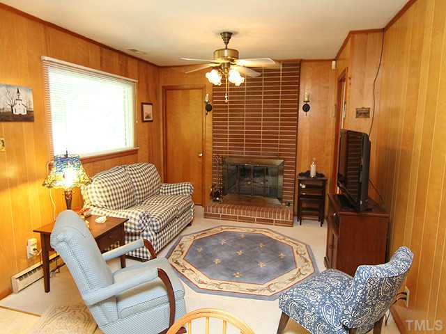5649 Guess Road Durham, NC 27712 - Photo 4 of 12 a living room with furniture and a window