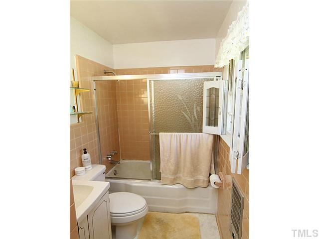 5649 Guess Road Durham, NC 27712 - Photo 6 of 12 a bathroom with a sink toilet and shower