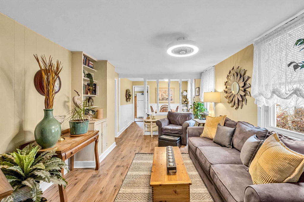 98 Pine Grove Street Springfield, MA 01119 - Photo 11 of 39 a living room with furniture and a wooden floor