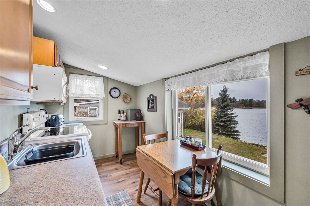 98 Pine Grove Street Springfield, MA 01119 - Photo 19 of 39 a very nice looking open dining room with kitchen island furniture a large window and a refrigerator