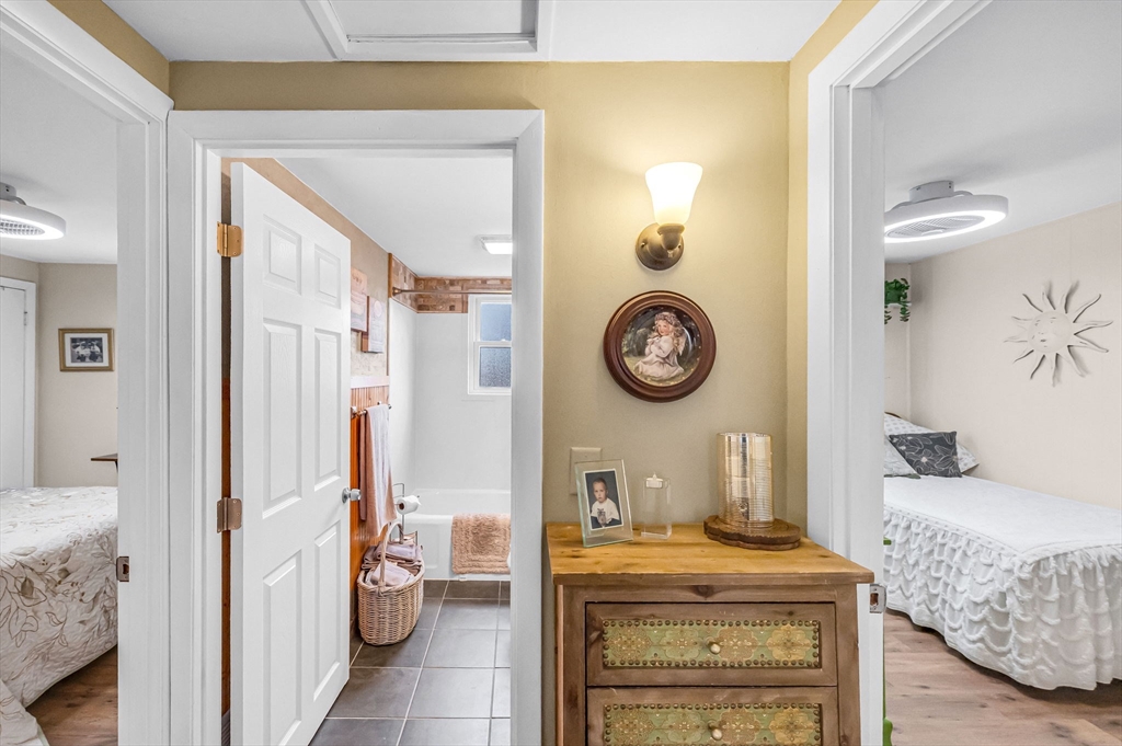 98 Pine Grove Street Springfield, MA 01119 - Photo 25 of 39 a living room with a couch and a clock on the wall