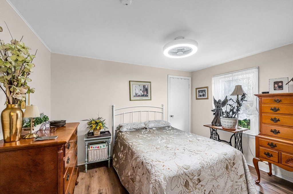 98 Pine Grove Street Springfield, MA 01119 - Photo 26 of 39 a bedroom with a bed and a dresser